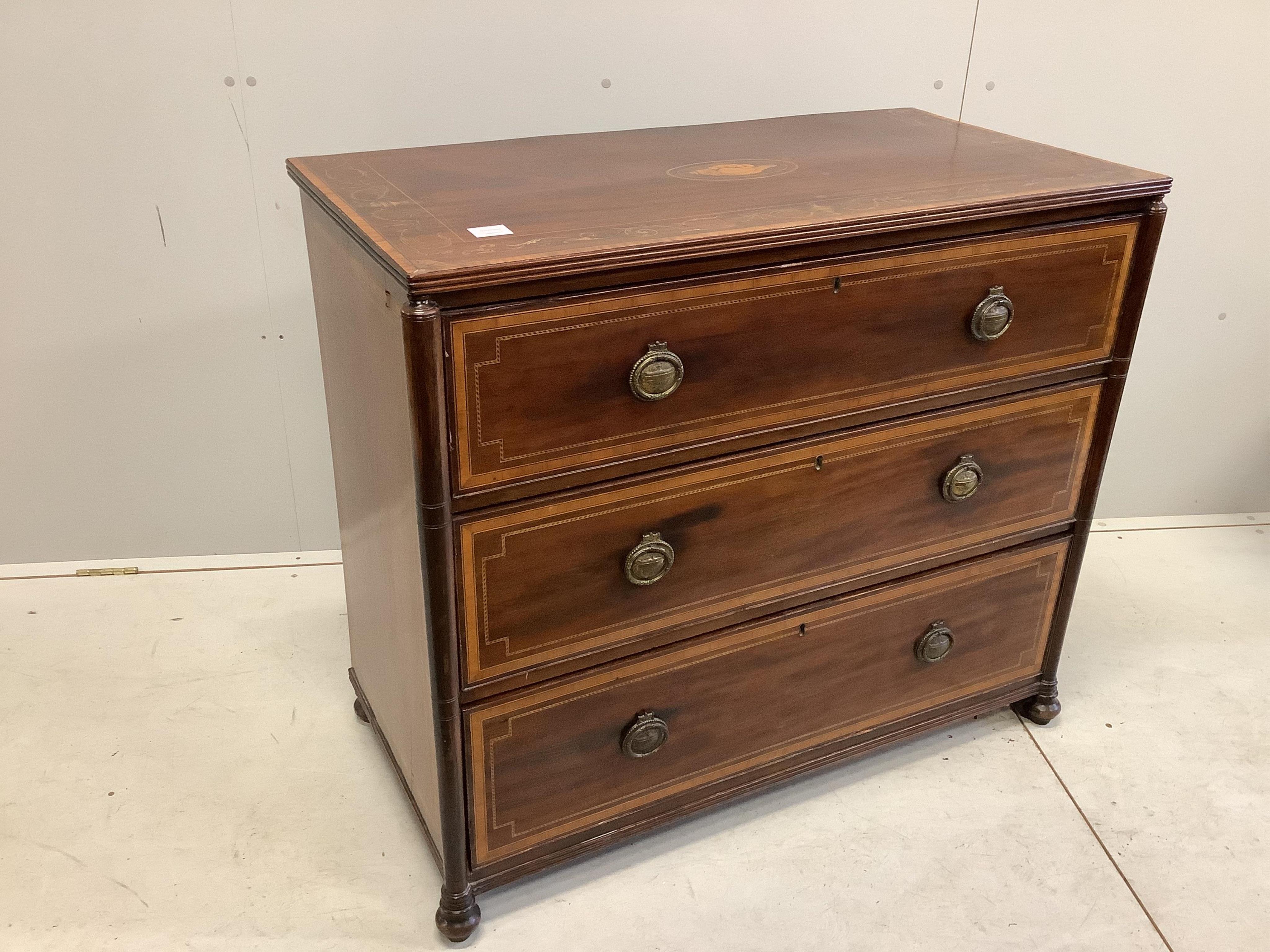 A 19th century later inlaid mahogany chest of three drawers, bears S & H Jewell retail label, width 101cm, depth 52cm, height 87cm. Condition - fair